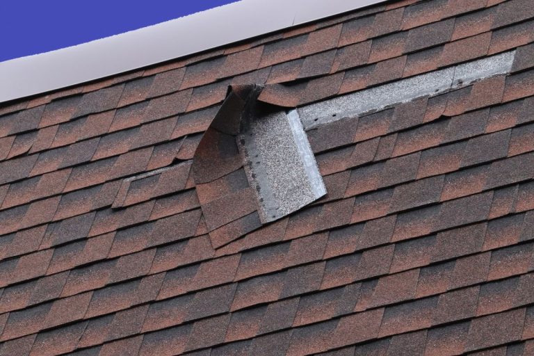 Damaged Brown Roof Shingle - Wind Damage. Edina