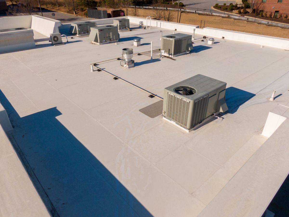 High Resolution Sunny Aerial Drone Image of a New TPO Roof on a Commercial Building With Visible HVAC Equipmen, Roofing. Edina, Minnesota