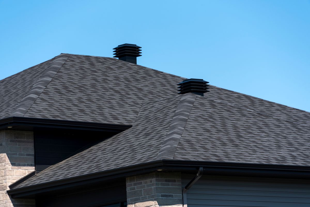 Ventilation covers on a new house shingle roof, Edina, MN
