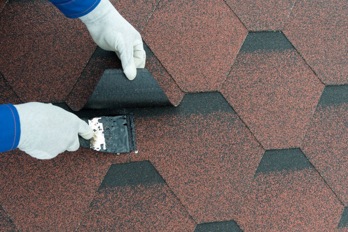 roof repair elimination of leakage smear seams and cracks with a trowel tar, Edina MN