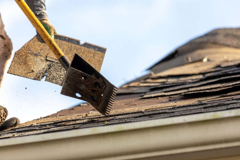 roofer removing roof nails with roof shingle remover, Edina, MN